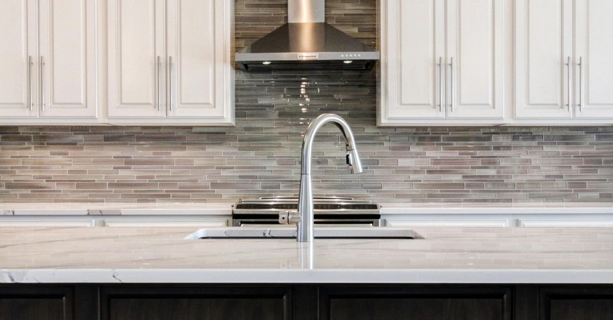 contemporary kitchen with glass backsplash